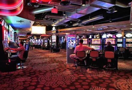 Rows of slot machines on a casino floor
